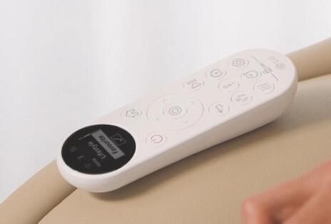 Wireless OLED remote on recliner arm.