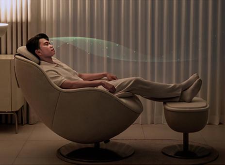 Massage recliner with holistic relaxation wave graphic.