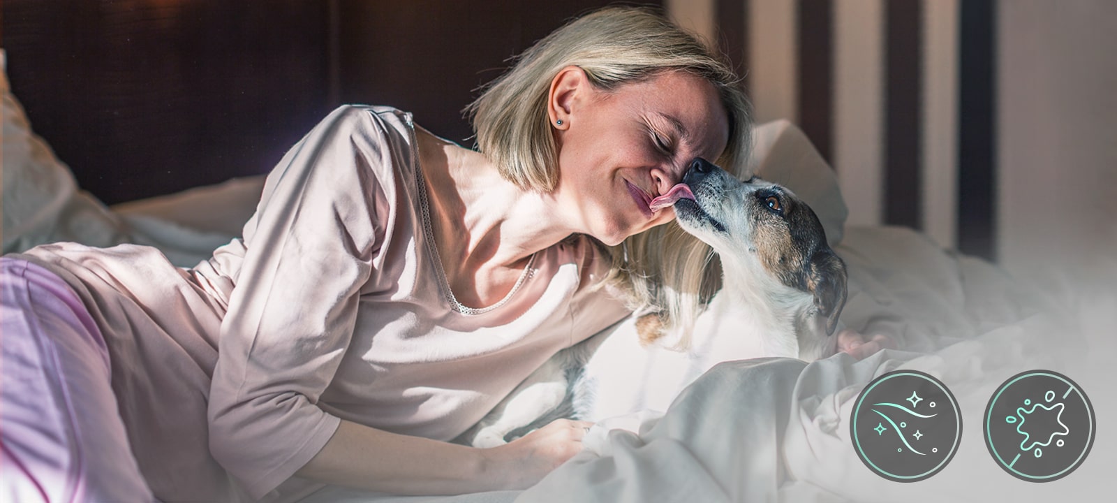 Woman with dog on bed - Pet Care cycle removes 99% pet odors