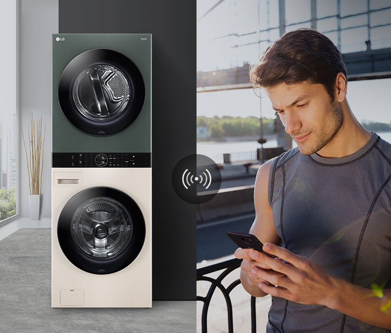 A man outdoors checking the WashTower via LG ThinQ app